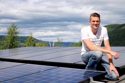 Sustainable Construction Management Technology student works on solar panels