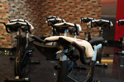 a photo of spin bikes at a spin studio.