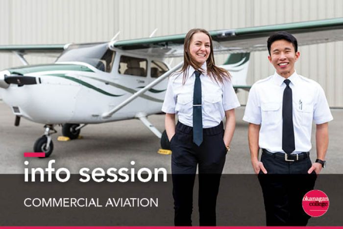 One male and one female student standing in front of small airplane