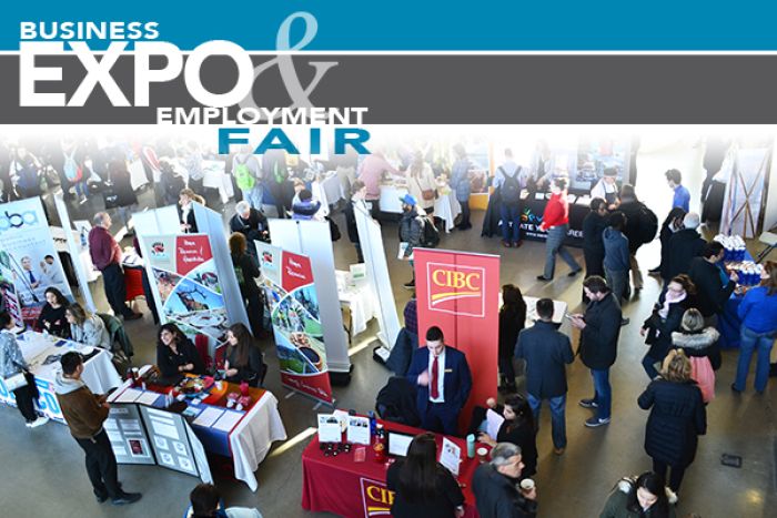 aerial view of booths set up in the Atrium with people mingling around, featuring a logo that reads Business Expo and Employment Fair