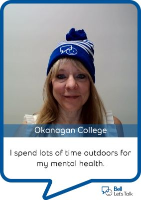 Person wearing a blue and white bell let's talk hat with a text bubble saying "I spend lots of time outdoors for my mental health"
