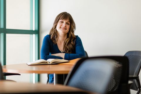 Female upgrading student sitting at a table studying