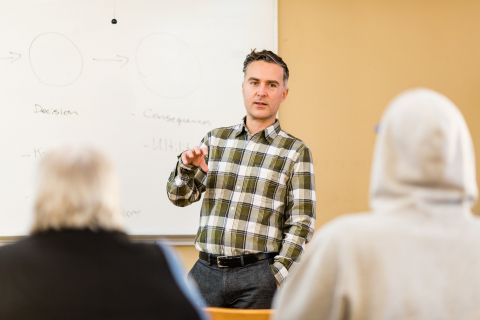 Philosophy Professor David Boutillier makes a point during class