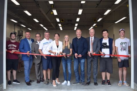 Dignitaries and students cut the ribbon to open the Vernon Trades Training Centre
