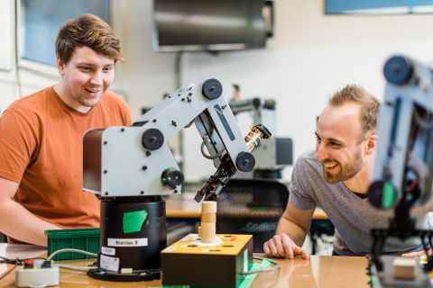 Mechanical Engineering students work with robotics in the lab