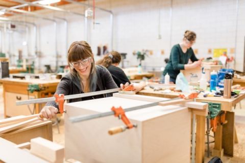 Female students working in the Carpentry shop
