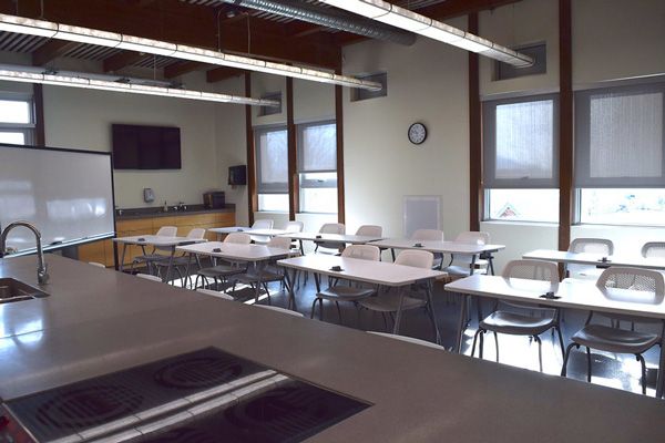 Empty classroom with desks and chairs
