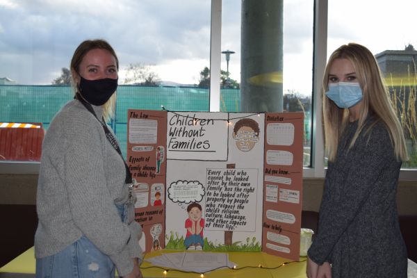 Two Early Childhood Education students showcase their presentation during National Child Day