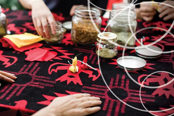 Indigenous printed table cloth with jars fill with herbs