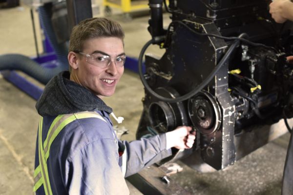 Student working in the automotive shop