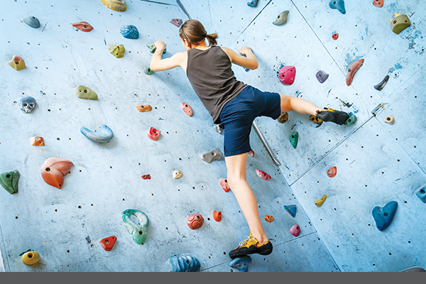 Person on climbing wall bouldering
