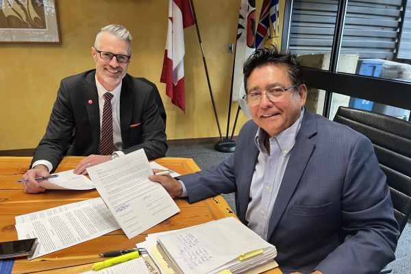 WFN Chief Robert Louis and OC President Neil Fassina sign an updated Memorandum of Understanding.