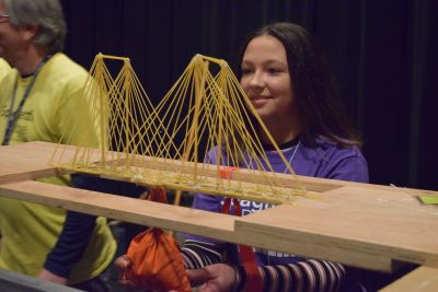 A student at the Spaghetti Bridge Building Contest