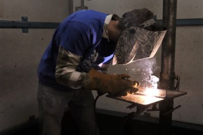 A student welding at Okanagan College