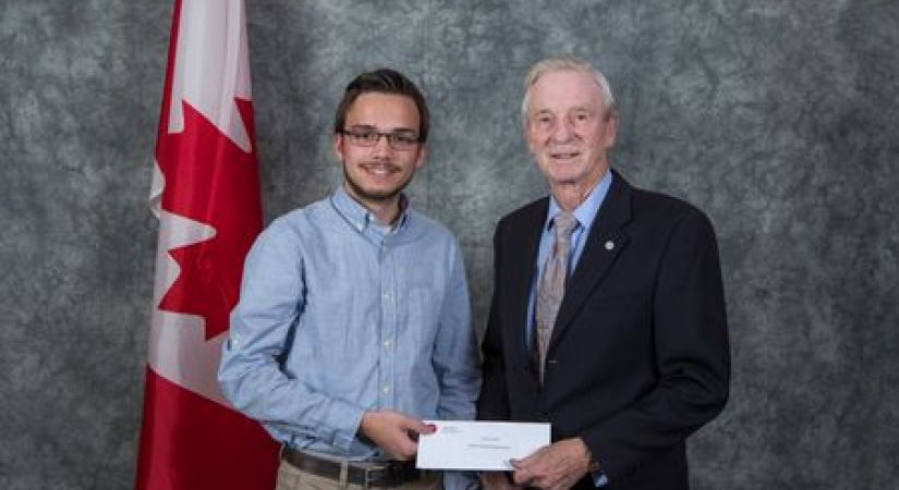 Taylor Cornett accepting the student award from Murray Roed at Okanagan College