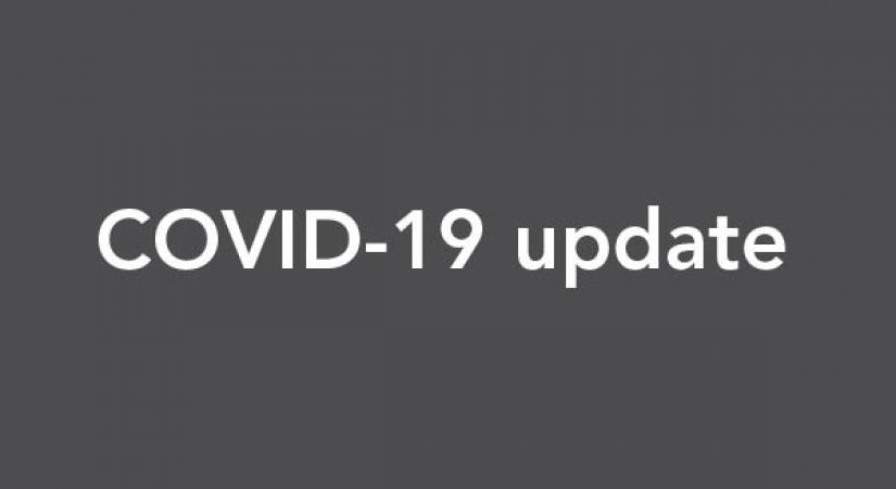 Text of "COVID-19 update" is overlain on a grey background