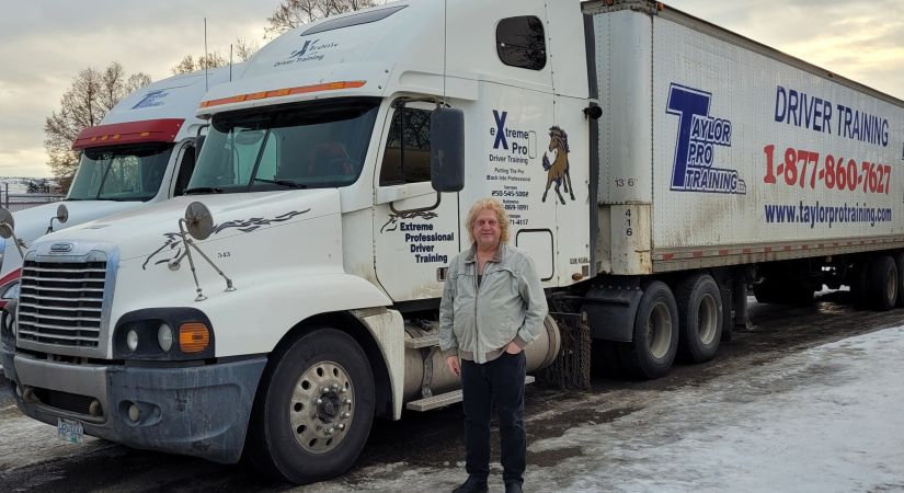 Student Keith Schmatlz standing in front of his professional truck.