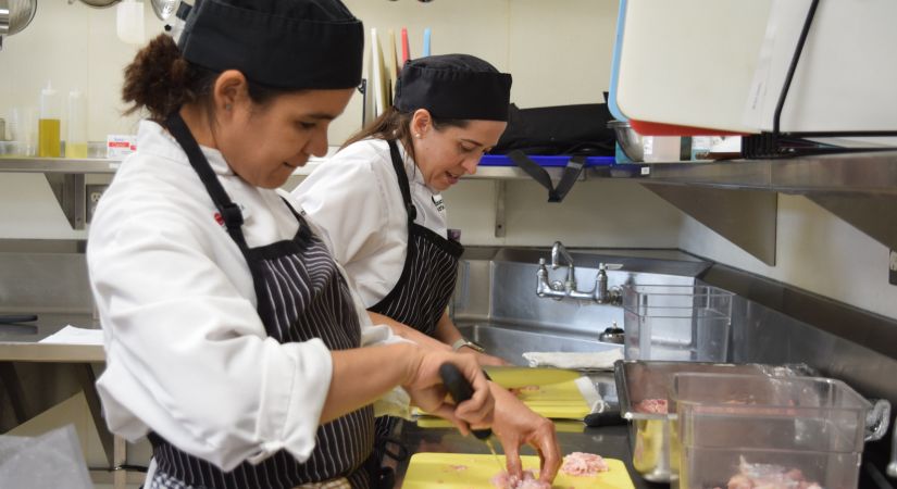 Student chefs prepare dinners for wildfire evacuees.